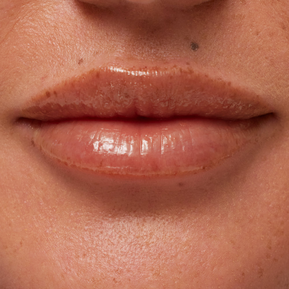 Close-up of a person's lips with a focus on texture and color.