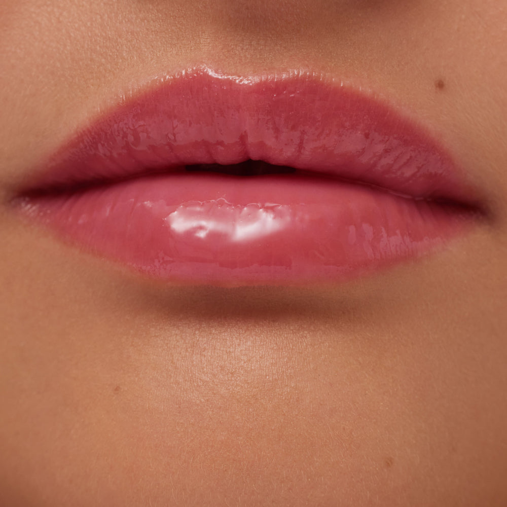 Close-up of glossy pink lips