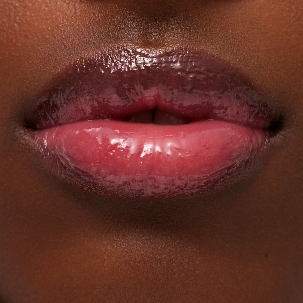 Close-up of glossy pink lips