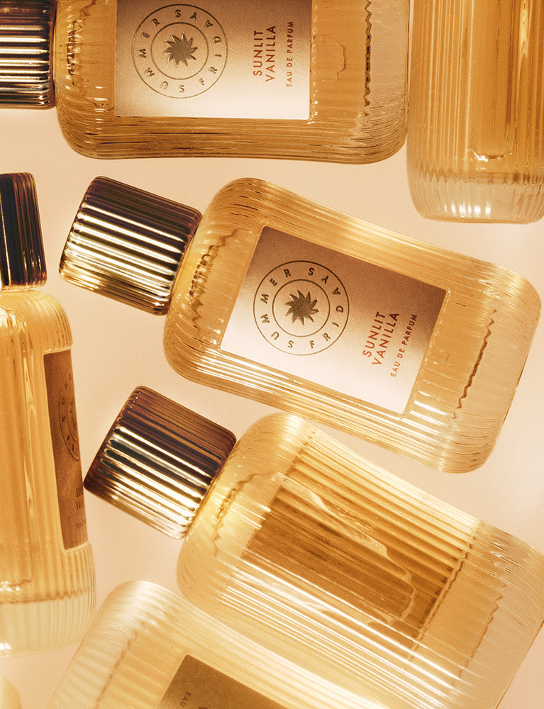 Gold-colored bottles with labels on a light background